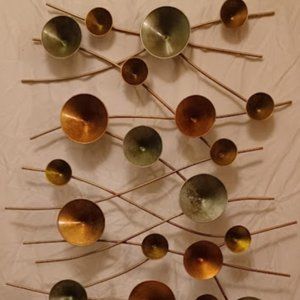 circle metal wall art 50in by 32 1/2in